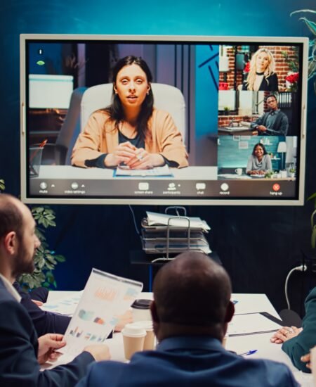 Business partners collaborating on global development project via videocall