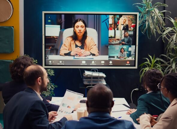 Business partners collaborating on global development project via videocall