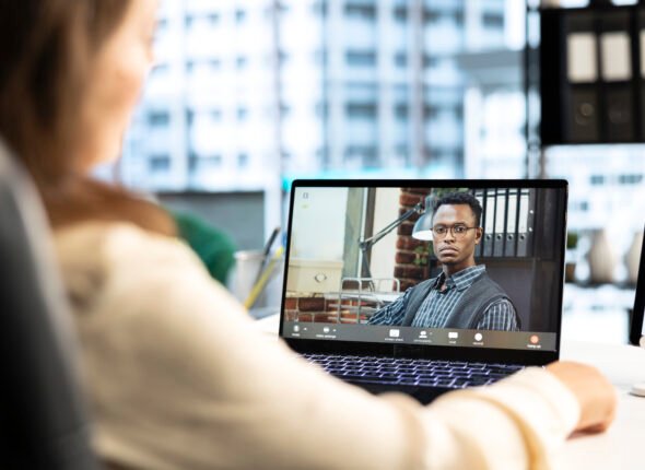 Female director discusses corporate social responsibility on videocall
