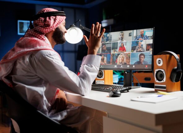 Muslim guy conducting an online meeting