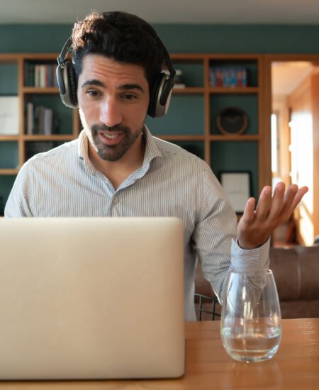 Man on a work video call from home.