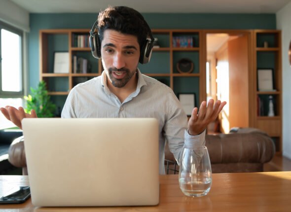 Man on a work video call from home.